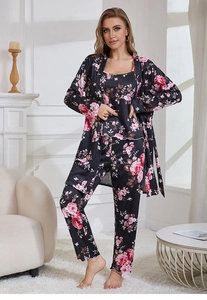 Three-piece floral sleepwear set detail showing rose print and scalloped hemline