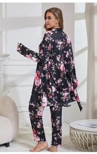 Detailed back view of a three-piece black floral pajama set with pink rose patterns