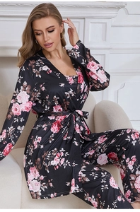 Detail of elegant black satin robe and trousers with pink rose floral print pattern