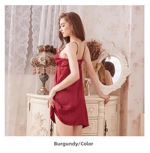 Close-up of wine red satin nightdress featuring delicate lace trim and deep V-neckline