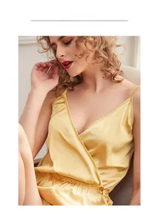 Detail of champagne satin sleepwear featuring a V-neckline and elegant side-tie design