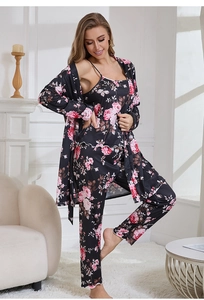Elegant three-piece black floral pajama set with satin texture and wavy ruffle edges