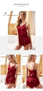 Close-up of wine red silk satin pajama set featuring delicate floral lace trim detail