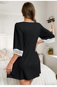 Detailed back view of black modal nightgown with white lace trim and V-neckline
