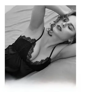 Close-up of black lace deep V-neckline on a silky sleeveless nightgown nightdress