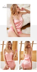 Pink satin camisole pajama set with delicate lace trim on V-neckline and shorts hem