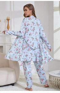 Detail of light blue floral pajamas with ruffled hem on sleeves and pants legs