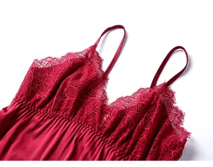 Close-up of wine red silk nightgown featuring delicate V-neck lace trim and thin straps