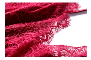 Close-up of red eyelash lace detail on thin ice silk nightwear for summer