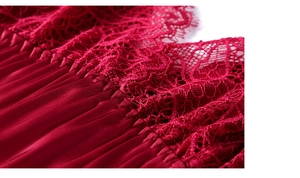 Close-up of deep red silk satin sleepwear with intricate eyelash lace trim detailing