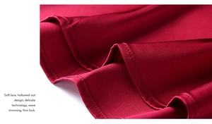 Detailed view of red silk satin fabric with smooth wave trimming and firm lock stitching