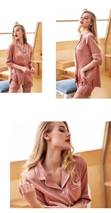 Detail view of pink satin pajama set featuring white contrast piping and lapel collar