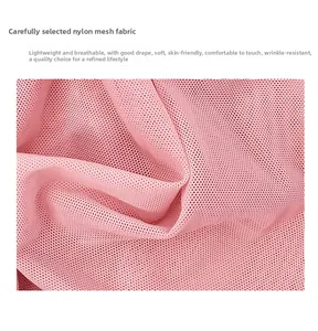 Detailed texture of breathable pink nylon mesh fabric showing soft and translucent quality