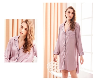 Detailed close-up of light purple silk satin nightshirt with dark piping and front pocket