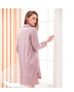 Detail of satin long-sleeve nightgown with contrast piping and side slit on back view