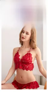 Detailed view of red lace lingerie set with mesh fabric and ruffled halter strap design