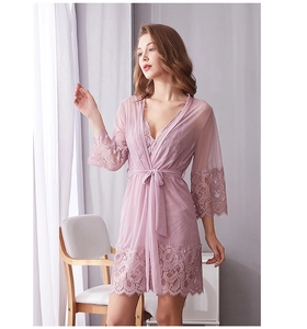 Detail of pink lace mesh robe set featuring floral embroidery and sheer belted design