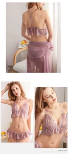 Detailed macro view of lace embroidery and mesh texture on three-piece lingerie set