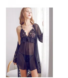 Detail of black floral lace trim and sheer mesh fabric on the three-piece lingerie set
