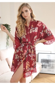 Detail of red floral satin robe with eyelash lace trim on sleeves and hemline