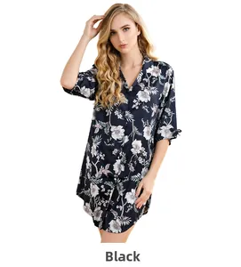 Detail of silk-like black floral long nightgown with delicate white flower prints