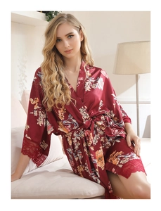 Detail of floral burgundy satin robe featuring intricate lace trim and a matching waist belt