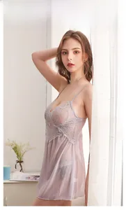 Detailed view of light purple lace lingerie dress with delicate mesh and floral patterns