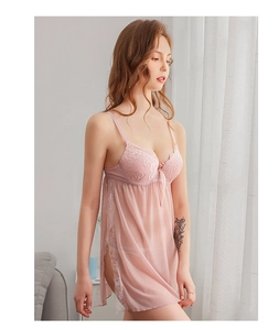 Detailed close-up of pink lace stitching and sheer mesh fabric on a sexy nightgown