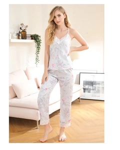 Detailed view of floral satin pajama set with delicate white lace trim and V-neckline