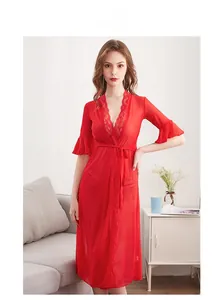 Close-up of a red sheer mesh robe with intricate floral lace trim and elegant waist tie