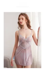 Detailed close-up of light purple floral lace and sheer mesh on a sexy chemise