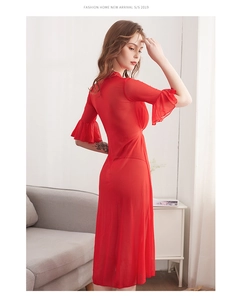 Detail of red sheer mesh robe with ruffle sleeves and translucent polka dot fabric