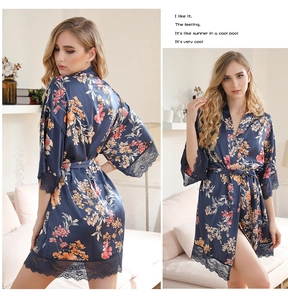 Detail of navy floral satin robe with V-neckline and elegant lace trim on sleeves