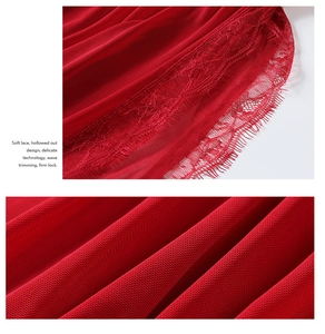 Detail of soft eyelash lace trim and hollowed out mesh fabric in deep red