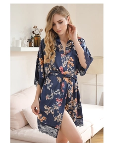 Detailed view of navy blue floral satin robe with black eyelash lace trim on sleeves