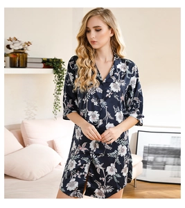 Detail of dark blue floral satin nightgown with elegant shirt collar and long sleeves