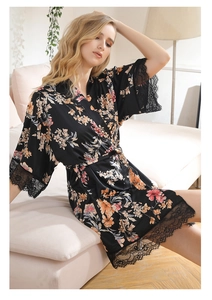 Detail view of black satin floral robe with pink flower prints and eyelash lace trim on sleeves