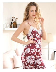 Detail of burgundy floral pajamas set with lace trim V-neck camisole and long pants