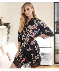 Close-up of floral satin robe featuring exquisite black wide lace trim on sleeves