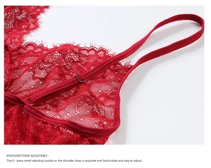 Macro detail of adjustable shoulder strap on red lace lingerie with metal buckle