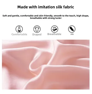 Detail of pink faux silk bridal robe fabric showing smooth texture and elegant drape