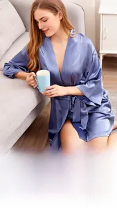 Elegant violet satin bridal robe with silk texture and V-neck, shown in cozy home setting