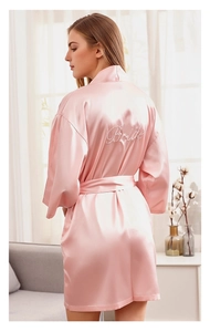 Pink satin bridal robe with white Bride embroidery on the back and silk finish