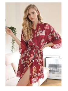 Detailed view of the red satin floral robe featuring intricate eyelash lace trim and belt