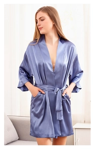 Detailed shot of lavender satin bridal robe with wide sleeves and waist tie belt
