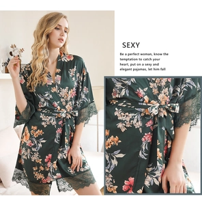 Detail of dark green floral satin robe with elegant eyelash lace trim and matching waist belt