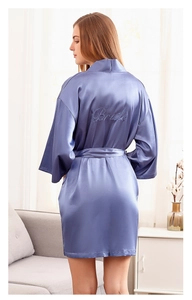 Rear view of lavender silk bridal robe featuring elegant Bride embroidery and waist tie