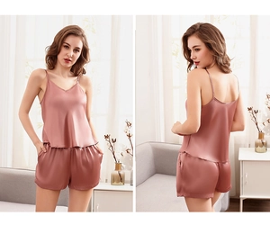 Detail view of pink satin camisole and shorts set with V-neckline and glossy finish