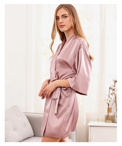 Detailed view of dusty pink silk bridal robe with kimono sleeves and matching belt