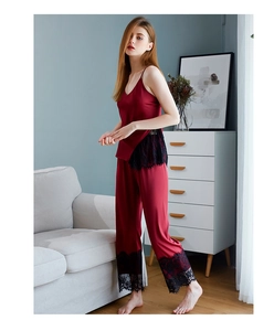 Lace-trimmed satin camisole and pants set in deep wine red with smooth finish